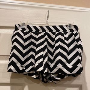 MNK chevron patterned cuffed shorts with front pockets and faux back pockets